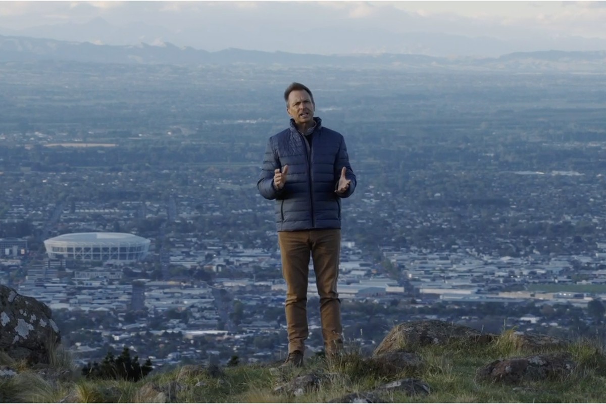 Phil Keoghan pictured with a Christchurch vista for The Amazing Race homecoming story.